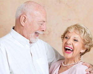 Older man and woman laughing together