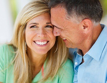 Smiling older man and woman outdoors