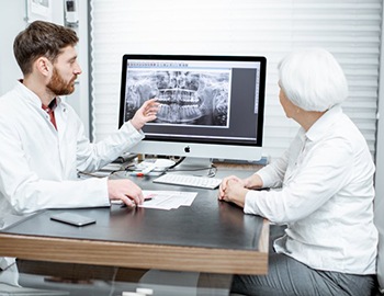 dentist showing patient their dental x-rays 