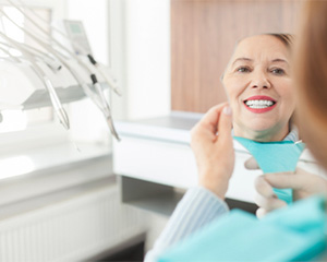 dental patient looking in mirror