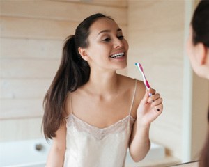 Woman brushing her teeth