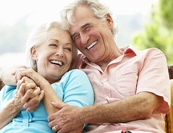 Smiling senior man and woman outdoors