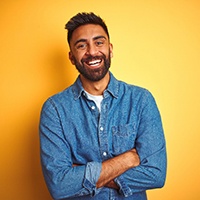 Man smiling after seeing dentist in Milwaukee for emergency