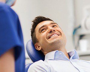 Smiling man in dental chair