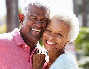 Smiling senior man and woman outdoors