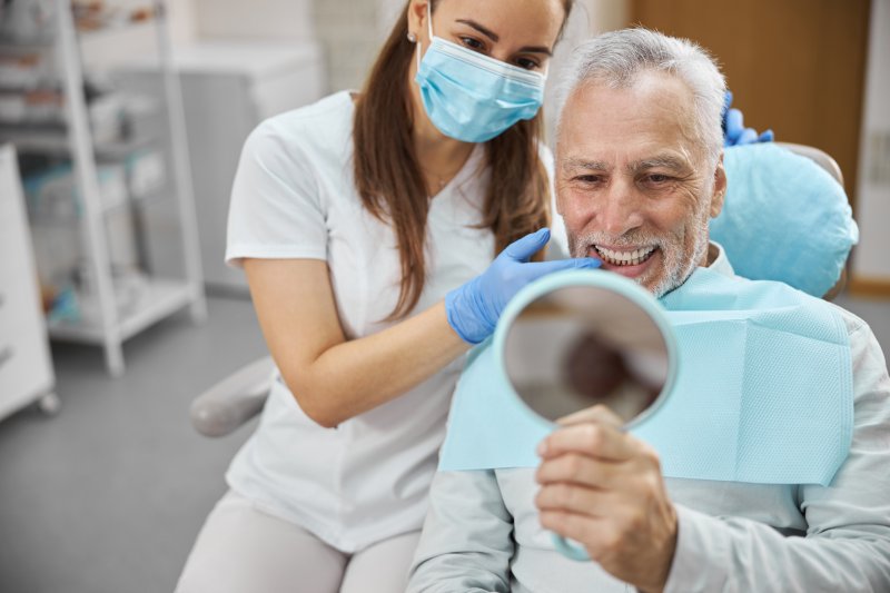 A Milwaukee implant dentist working with a patient