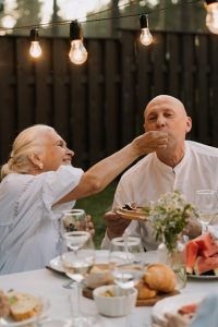 Older couple eating on a date